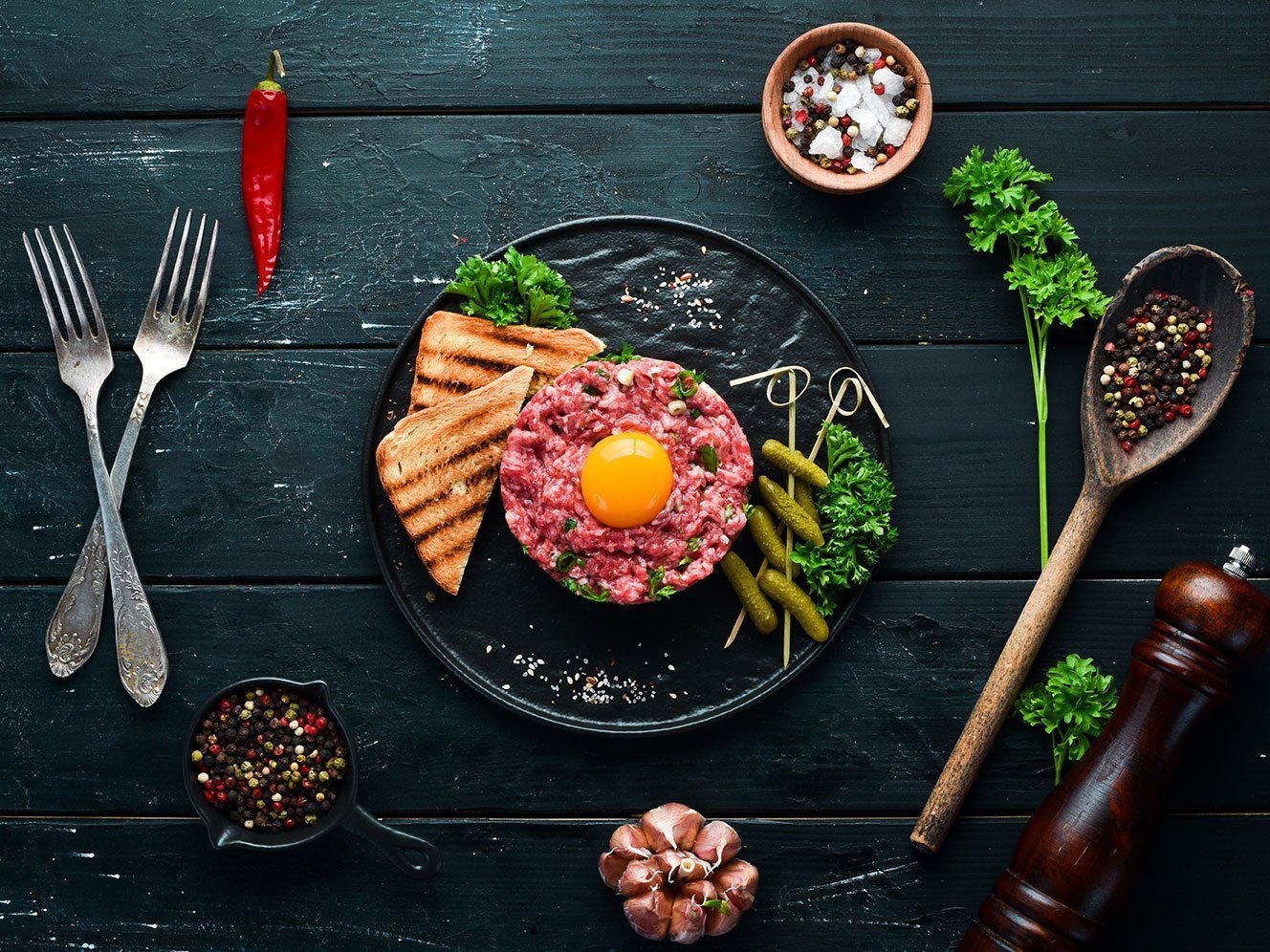 Beef Steak Tartare With Raw Egg Yolk, Pickled Cucumber And Onion