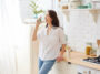 Gorgeous Woman Drinking Water In Her Kitchen